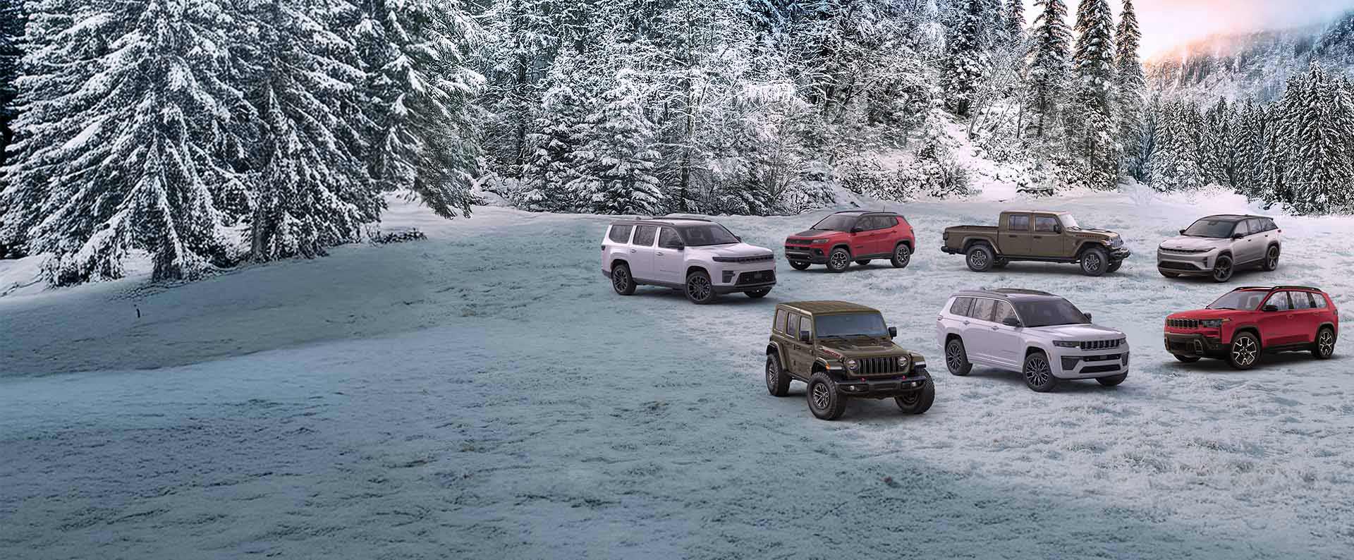 Una formación de siete vehículos Jeep 2026 estacionados en un claro cubierto de nieve, con un bosque de fondo. En la fila delantera: un Wrangler Rubicon X en verde oliva, un Grand Cherokee Summit blanco y un Cherokee Overland rojo. En la fila trasera: un Grand Wagoneer Summit Obsidian blanco, un Compass Trailhawk rojo, una Gladiator Mojave X en verde oliva y un Wagoneer S Launch Edition 2025 plateado.